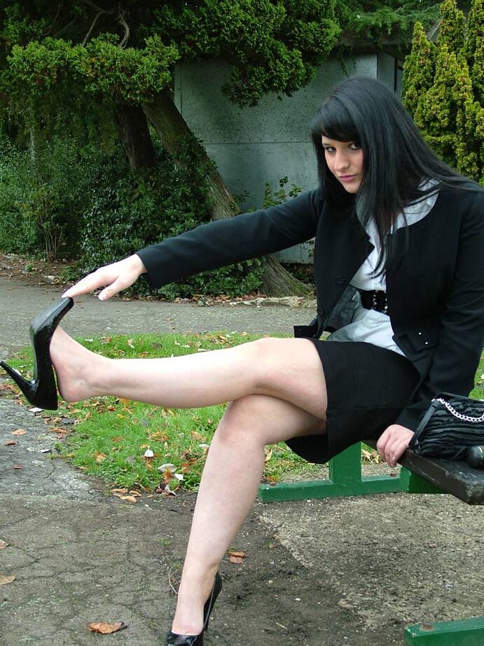 16P Fully clothed model Nicola takes a walk on park pathway in her new black pumps