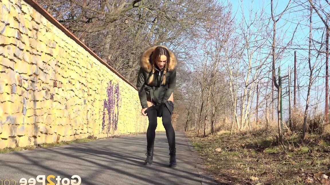 15P Cynthia Vellons enjoys a public piss on a path