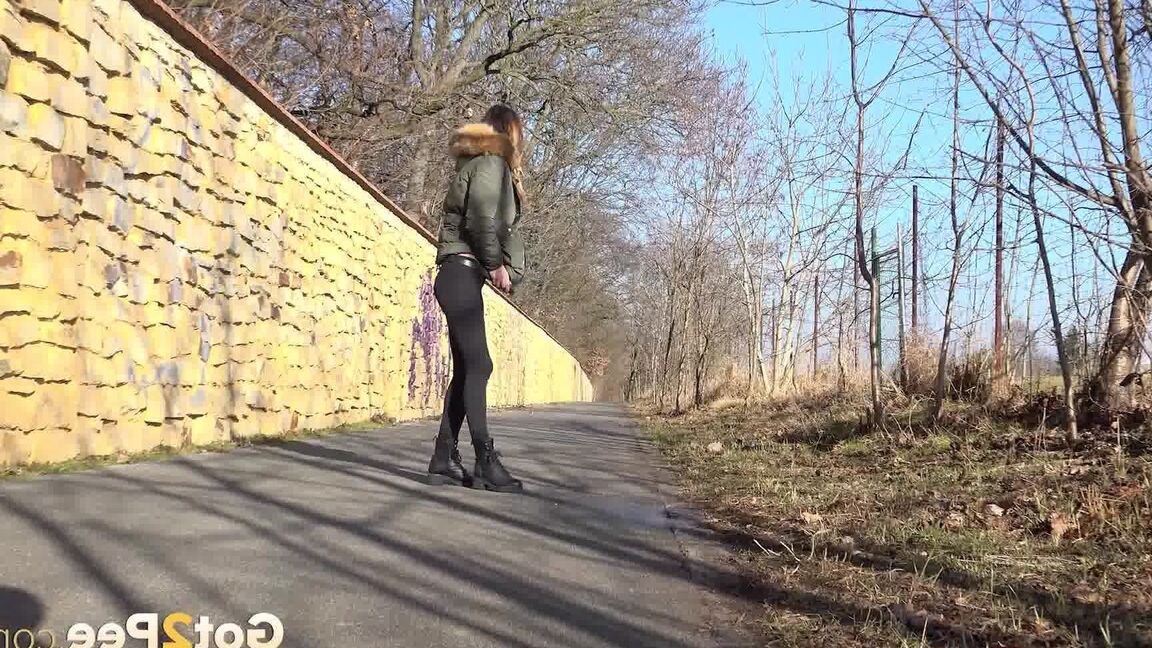 15P Cynthia Vellons enjoys a public piss on a path
