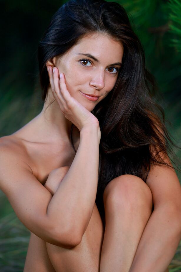 18P Young brunette Aleksandrina strikes great nude poses in front of fir trees