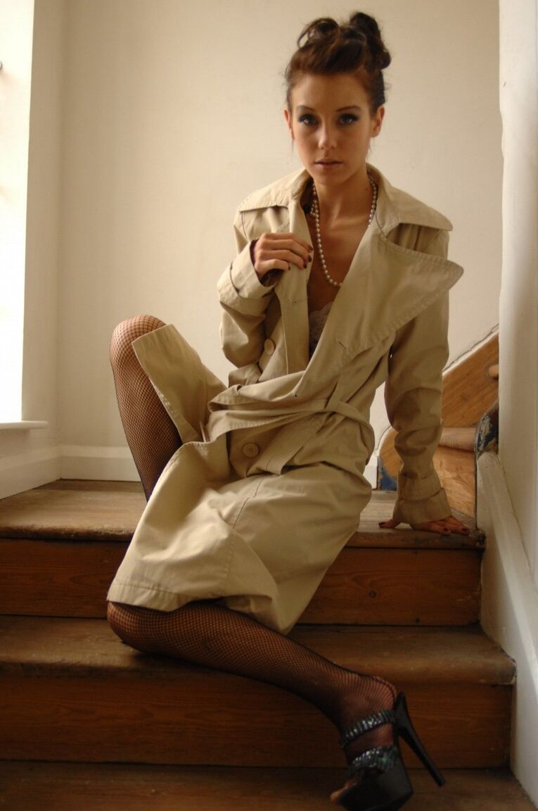 12P Slender solo model takes off her trenchcoat to model in lace undies and nylons
