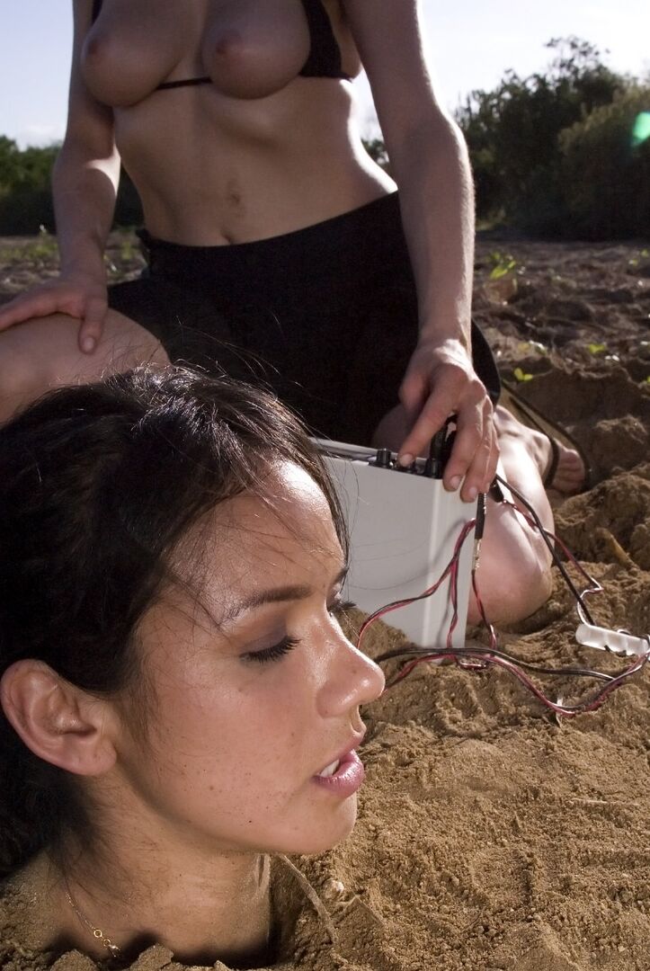 20P Buried babe Nadia Styles gets tortured by a kinky curly haired female