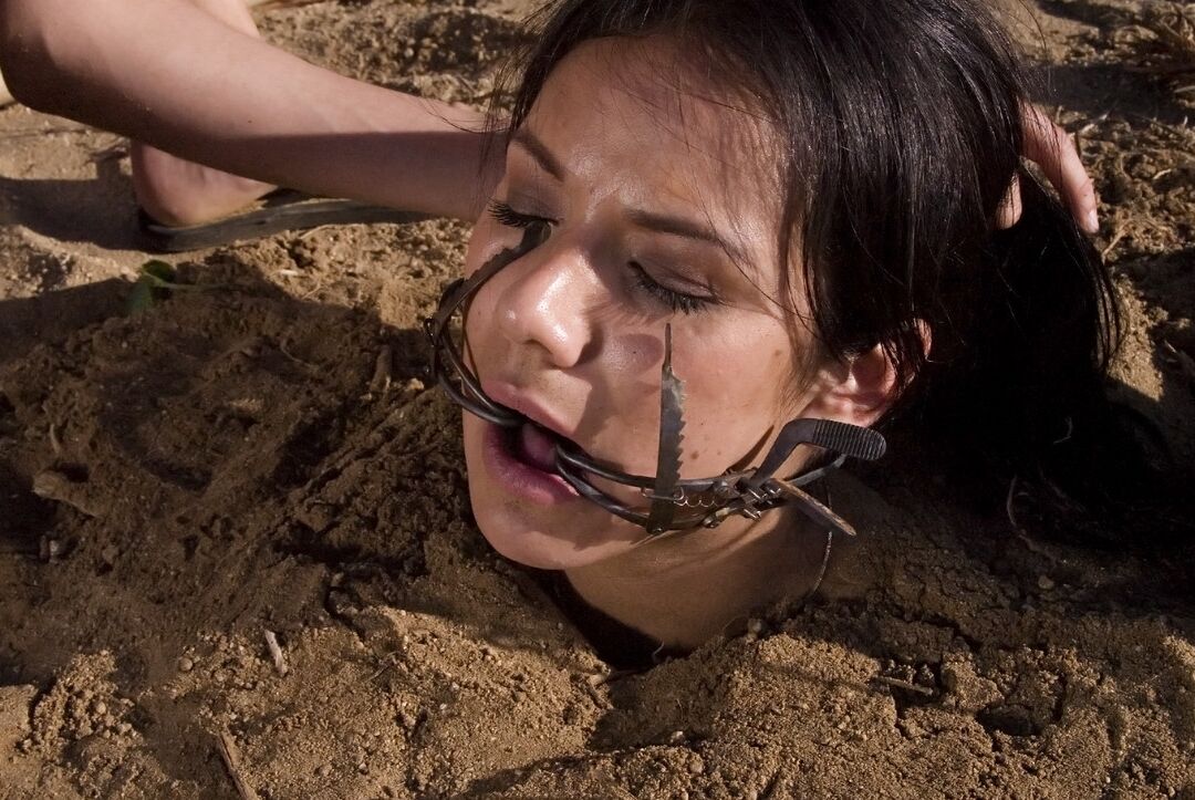 20P Buried babe Nadia Styles gets tortured by a kinky curly haired female