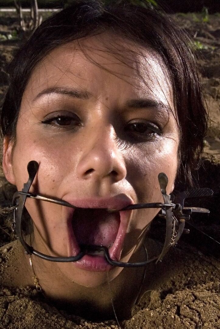 20P Buried babe Nadia Styles gets tortured by a kinky curly haired female