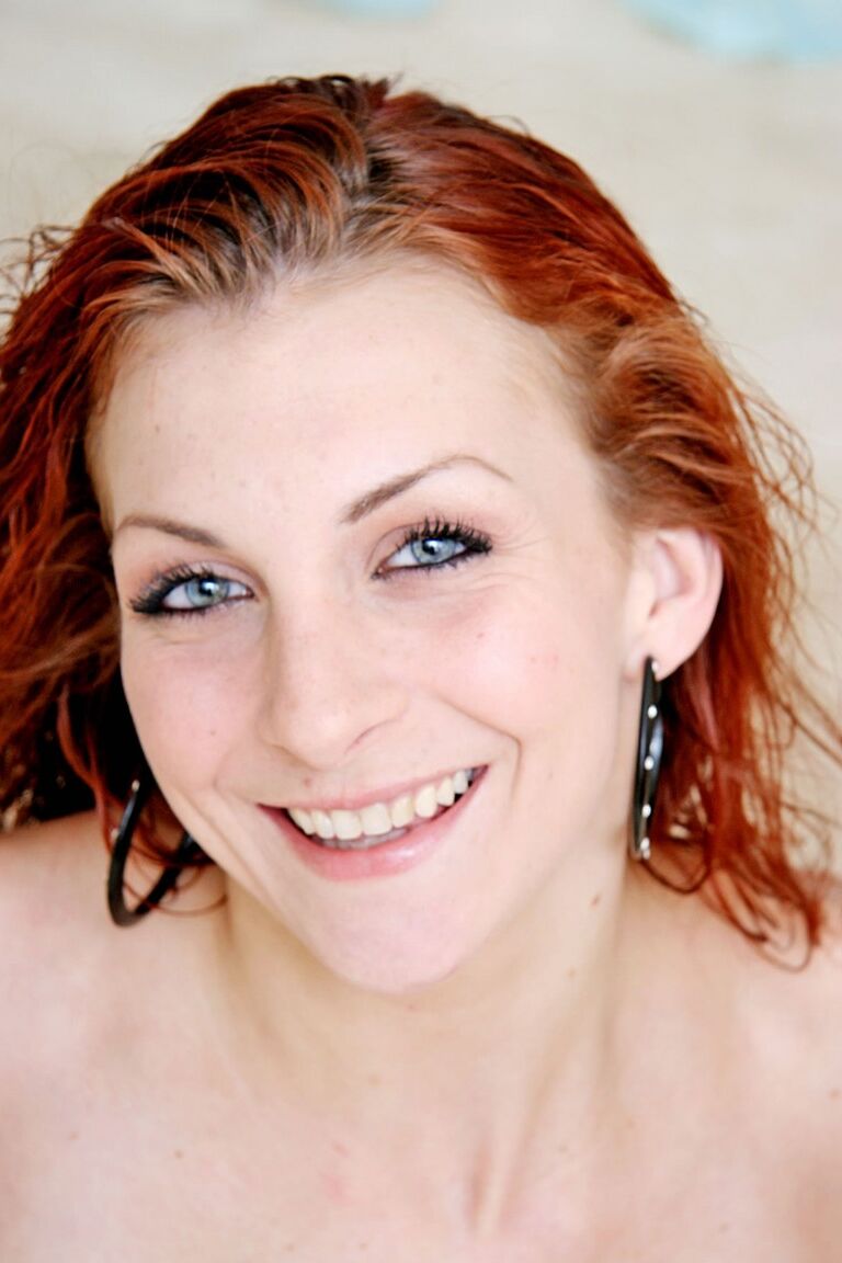 21P Awesome redhead girl Jordan Minor stripping in front of the camera