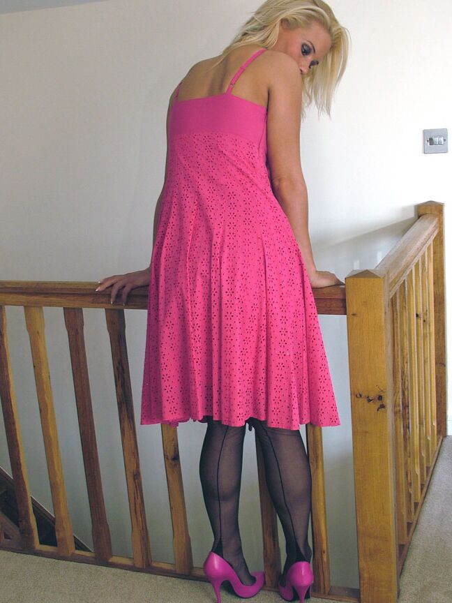16P Blue eyed blonde models backseam nylons in pink pumps and a matching dress