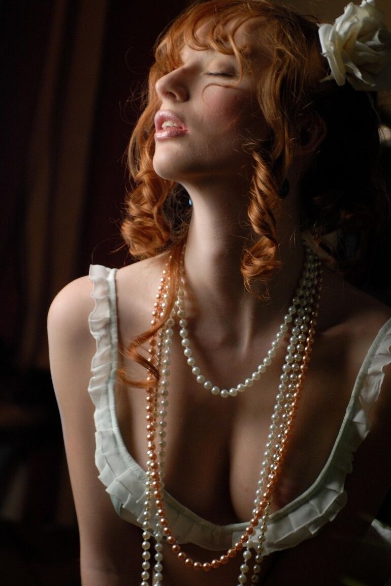 16P Natural redhead Clelia strikes tempting poses at home by candlelight
