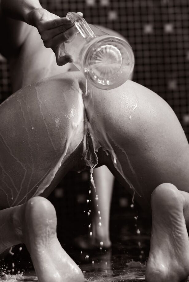 16P Young brunette Veronica Snezna covers her naked body in milk in a shower
