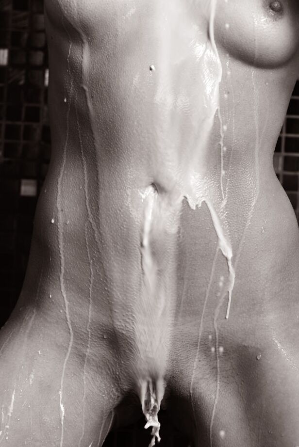 16P Young brunette Veronica Snezna covers her naked body in milk in a shower