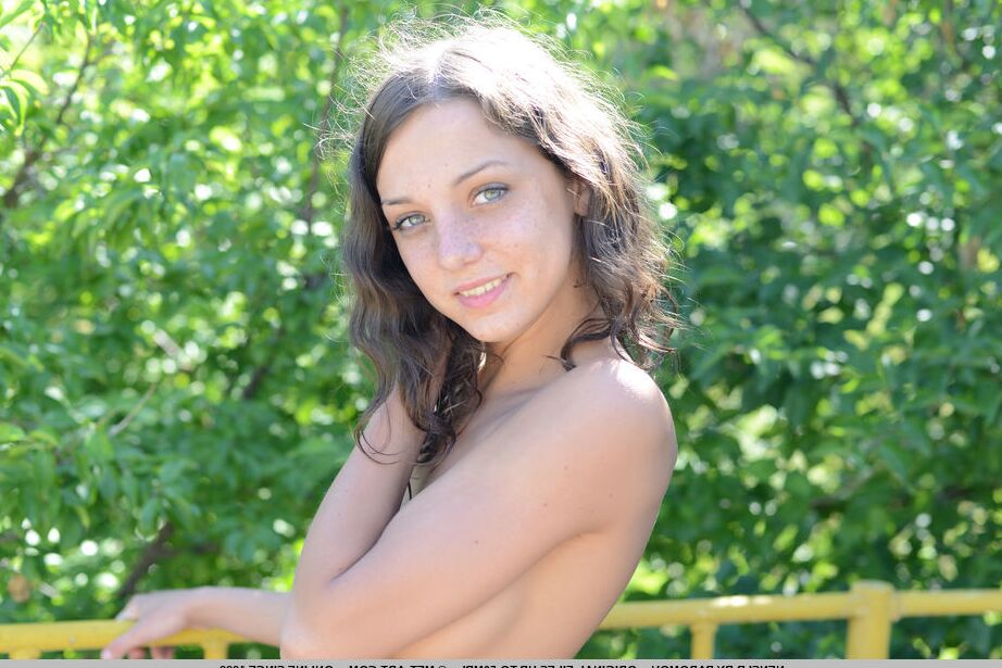 18P Russian teen Nensi B models totally naked in a park setting