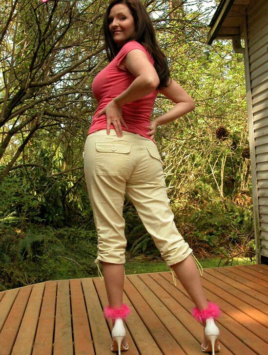 15P Mature lady Tasty Trixie flashes a whale tail while stripping to heels on deck