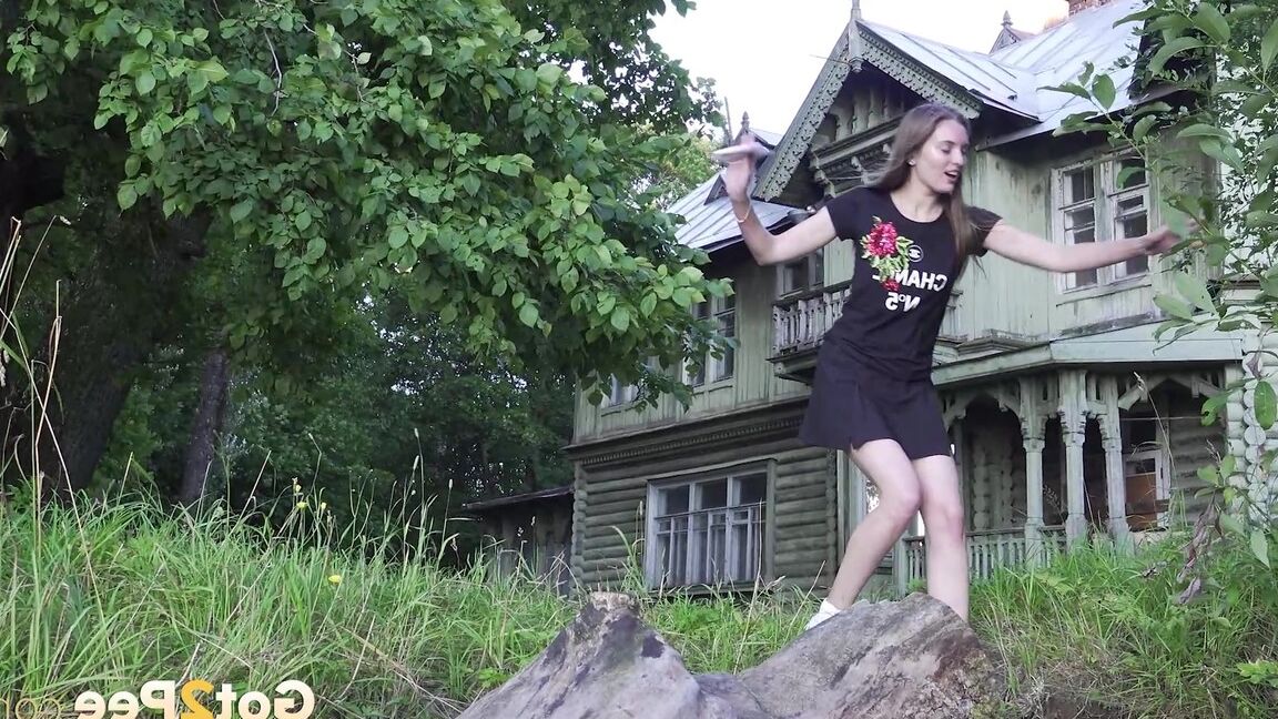 15P Caucasian girl Vika squats for a piss not too far from a big house