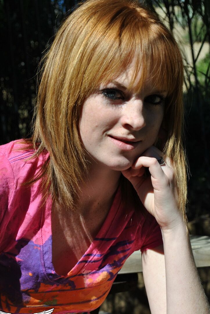 12P Young redhead Kate Cooper hikes her skirt and flashes her twat against a fence