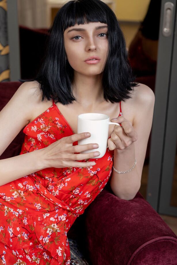 18P Ivy Darke seductively undresses on the couch and flashes her hard nipples and