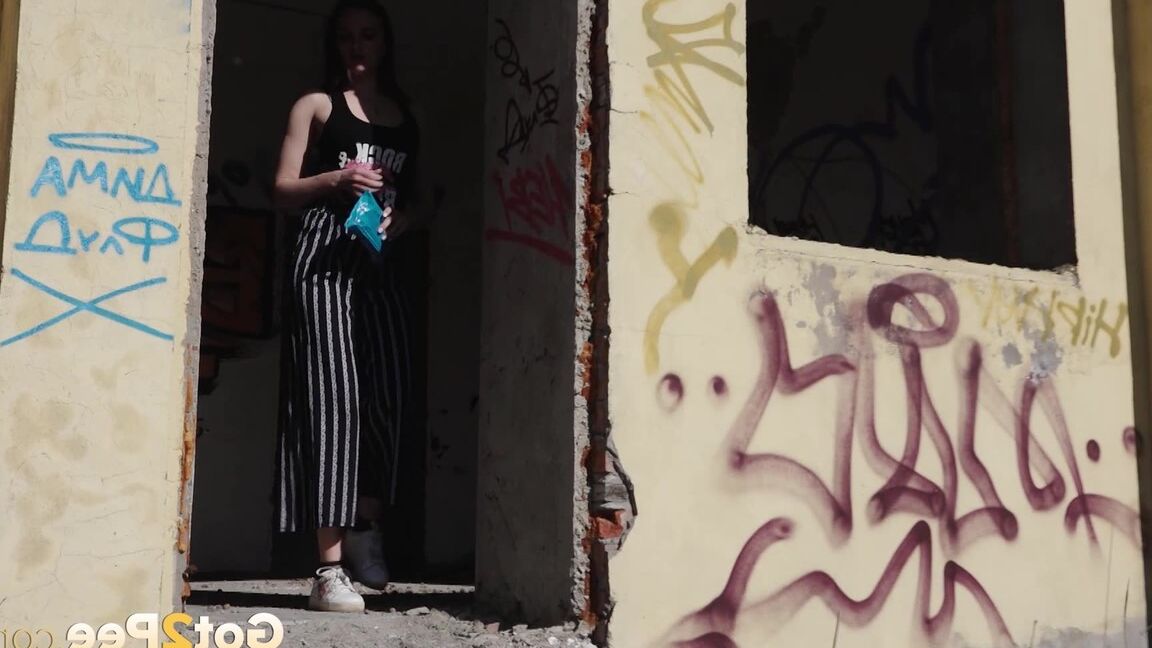 15P Sexy babe squats in abandoned building to piss