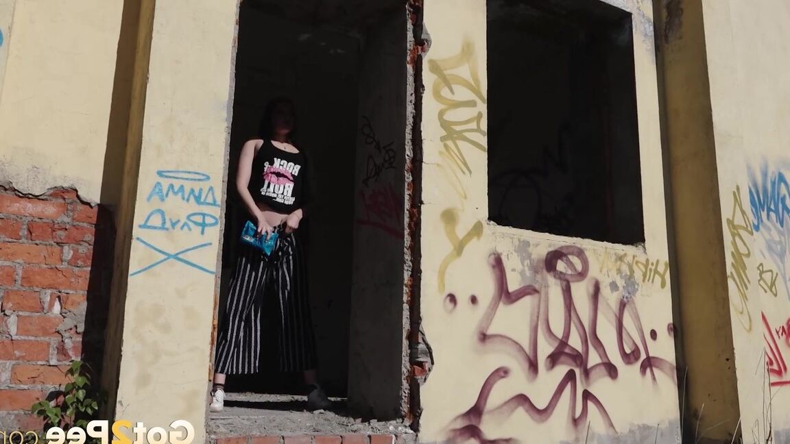 15P Sexy babe squats in abandoned building to piss
