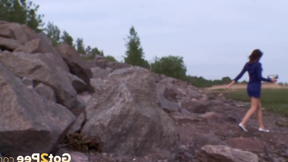 15P Caucasian girl Kristina squats for a piss on boulders in flat shoes