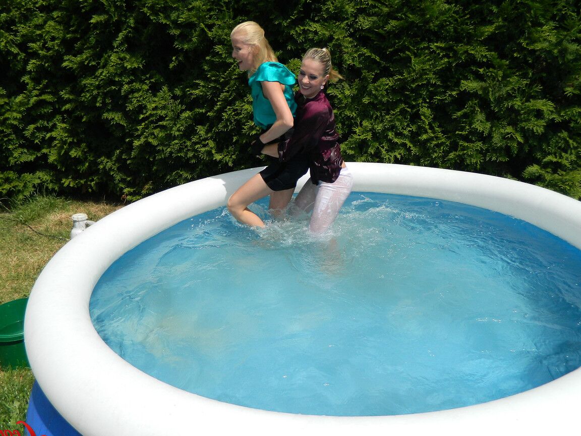15P Clothed lesbians get soaking wet after getting into an above-ground pool