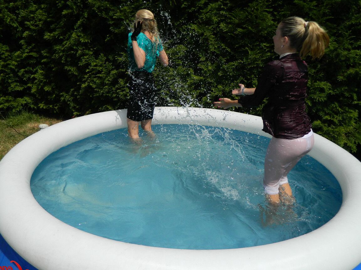 15P Clothed lesbians get soaking wet after getting into an above-ground pool