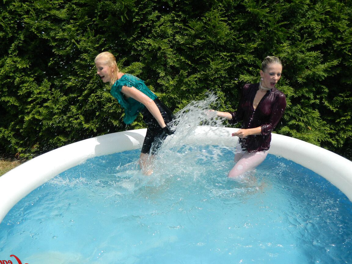 15P Clothed lesbians get soaking wet after getting into an above-ground pool