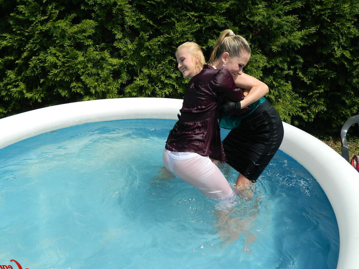 15P Clothed lesbians get soaking wet after getting into an above-ground pool