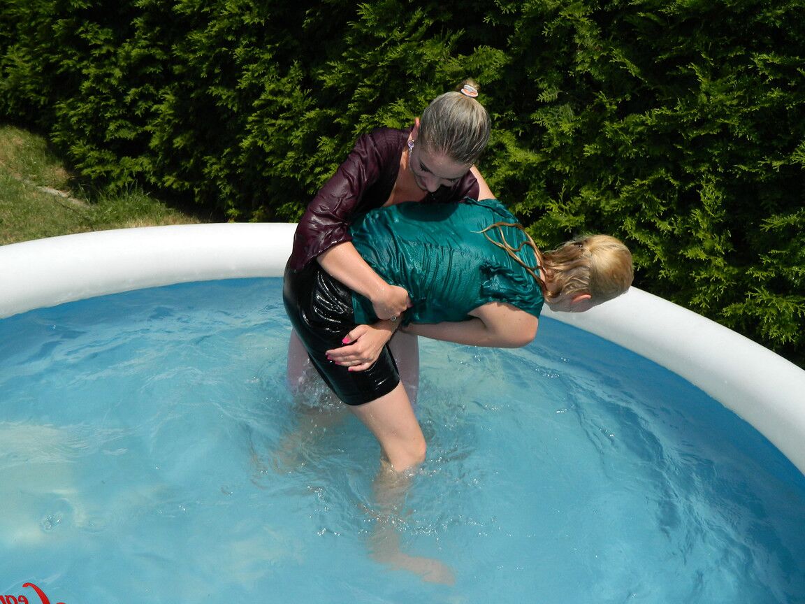 15P Clothed lesbians get soaking wet after getting into an above-ground pool