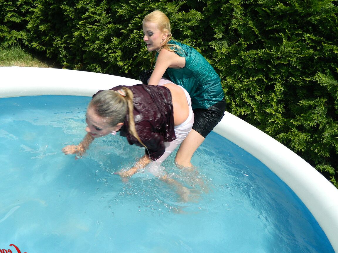 15P Clothed lesbians get soaking wet after getting into an above-ground pool