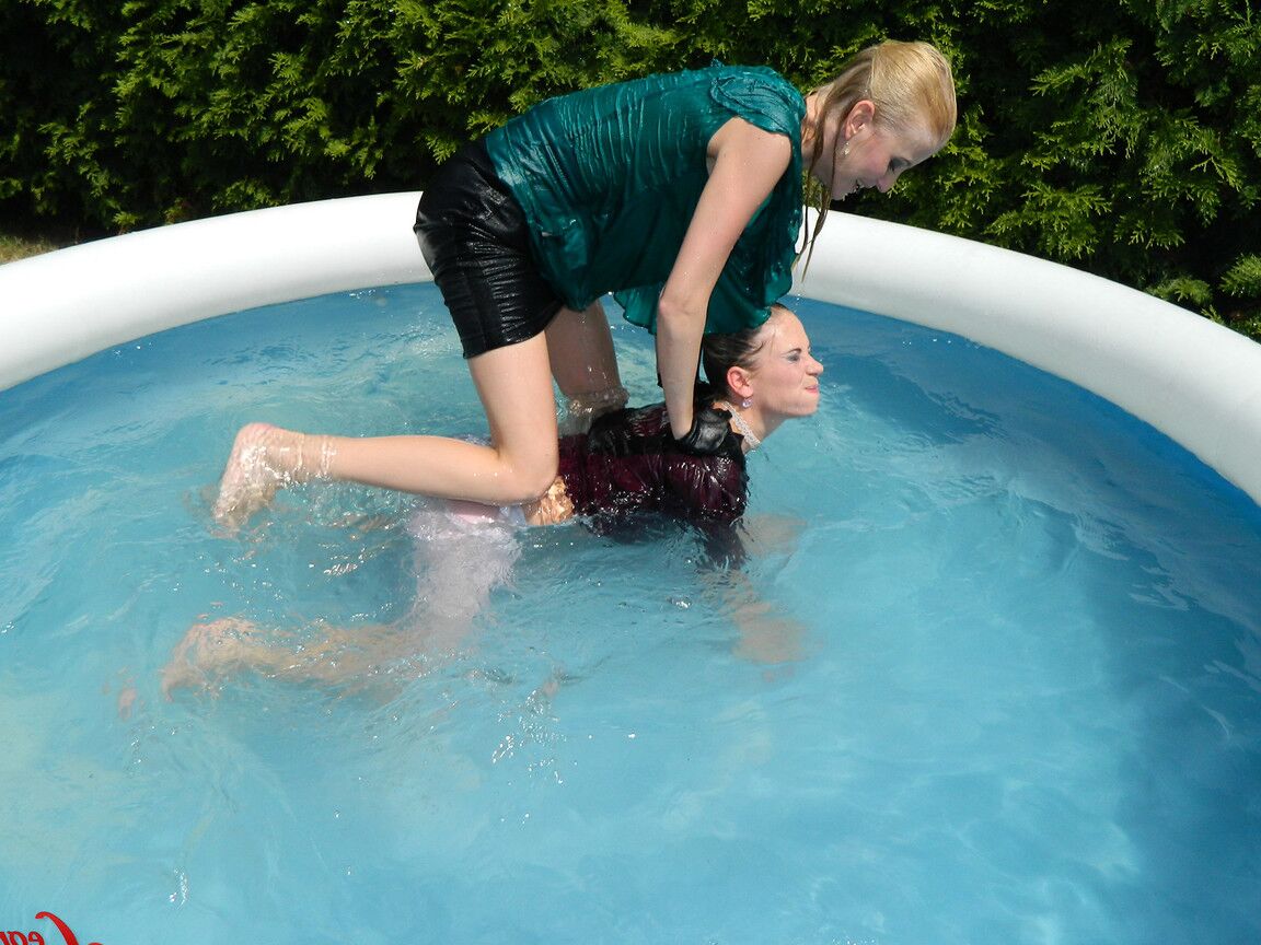 15P Clothed lesbians get soaking wet after getting into an above-ground pool