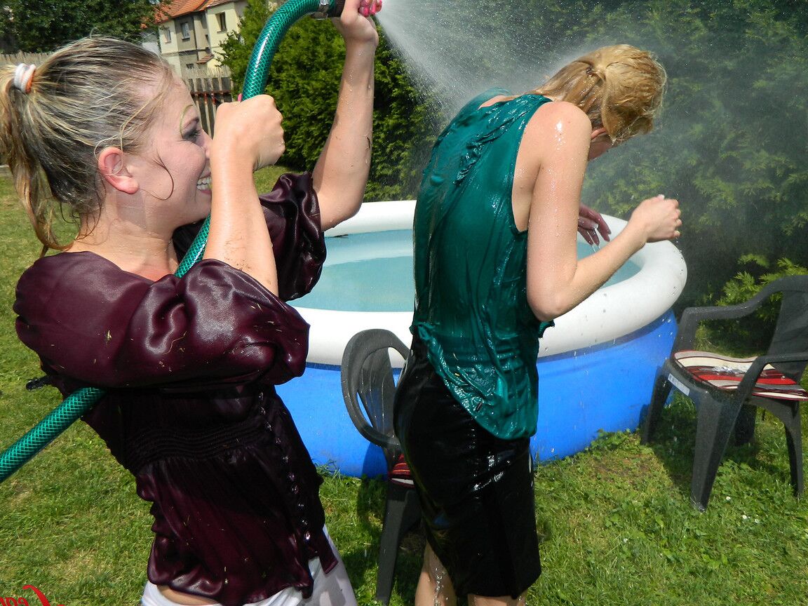 15P Clothed lesbians get soaking wet after getting into an above-ground pool