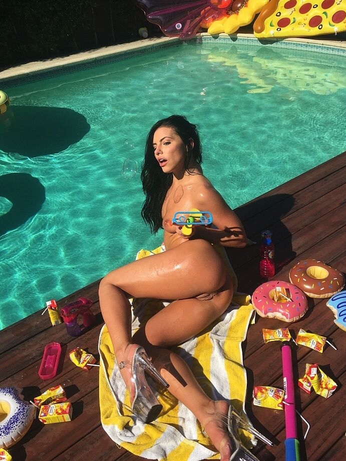 16P Gorgeous brunette presents her asses in a fine nudity solo by the pool