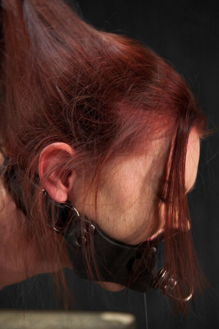 21P Redheaded babe Chastity Lynn gets toyed while tied to a metal construction
