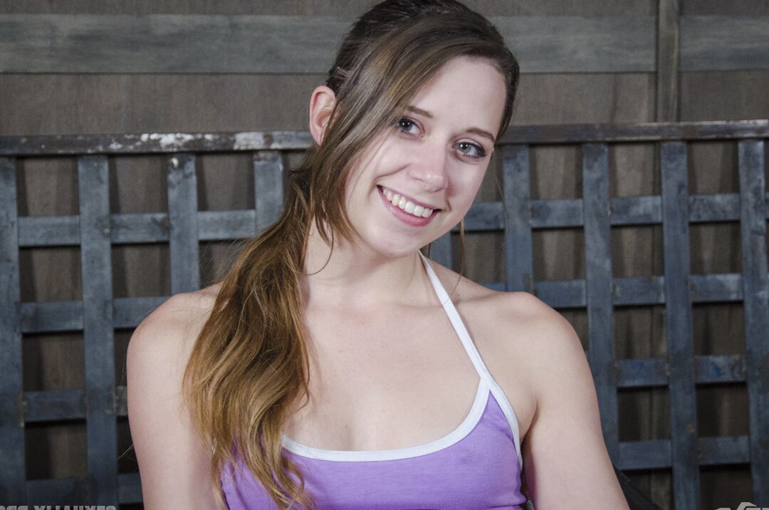 15P College girl Zoey Laine is spit roasted while held in place with stanchions