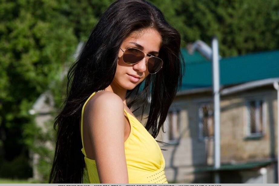 18P Russian teen Malina A bares her tits and twat on a bench in the backyard