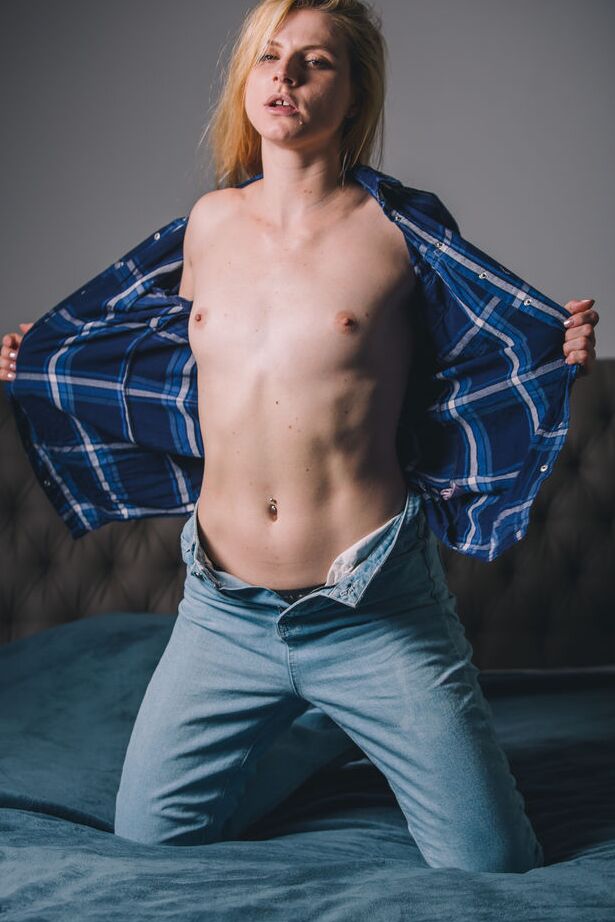 16P Young redhead Jade dons a ball gag while fingering her pussy on a bed