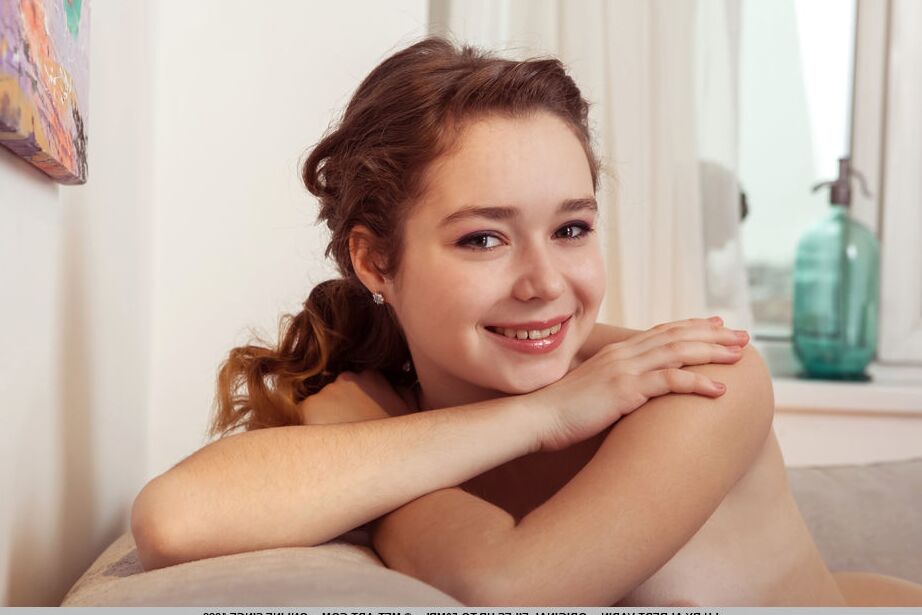 18P Beautiful teen Lu removes mesh stockings to get completely naked on a couch
