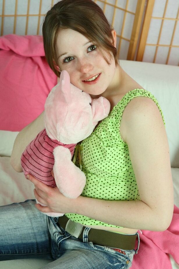 16P Sweet young girl Angela uncovers her tiny tits while playing with a plush toy