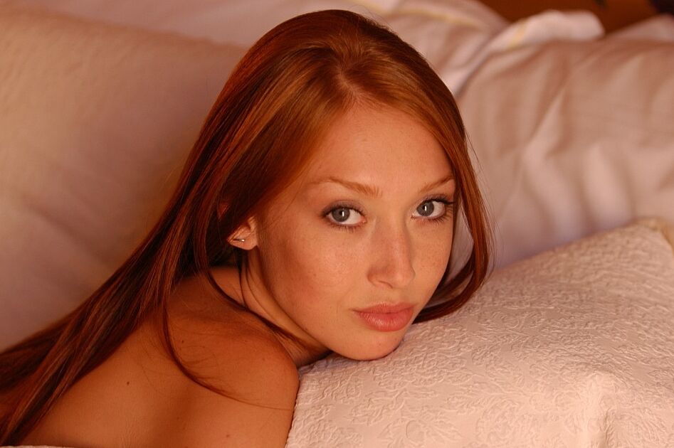 21P Amateur redhead with nice titties Leanne poses naked at her home