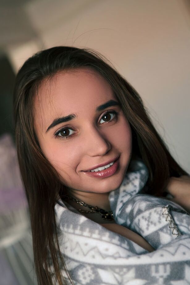 18P Young brunette Messiah wraps herself in a blanket before posing in the nude