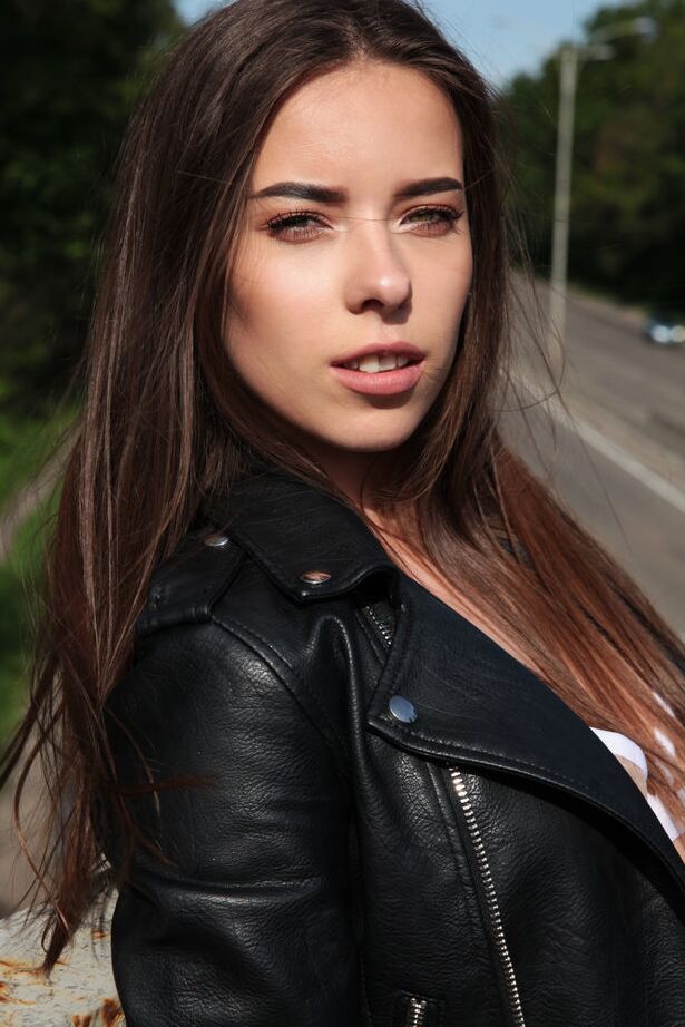 18P Young brunette Chokolady shows her tight ass and perky tits on a patch of sand