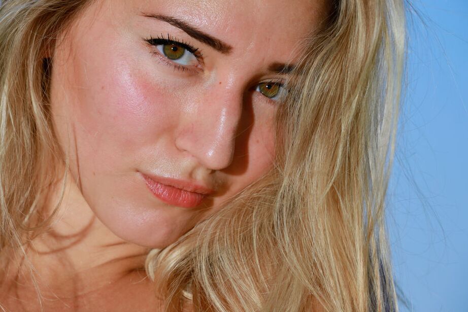16P Blonde hottie Amaly goes nude on a cliff overlooking the ocean She poses her