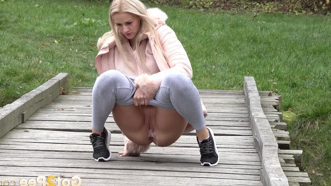 15P Blonde Katy Sky shows her bald beaver while squatting outside for a pee