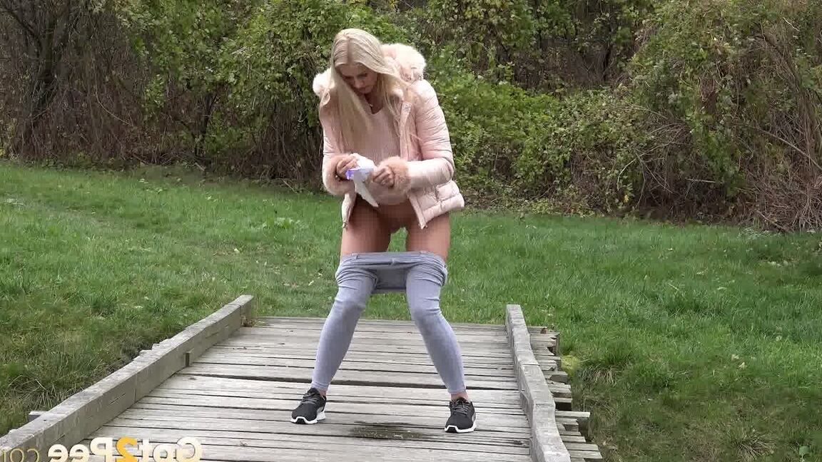 15P Blonde Katy Sky shows her bald beaver while squatting outside for a pee