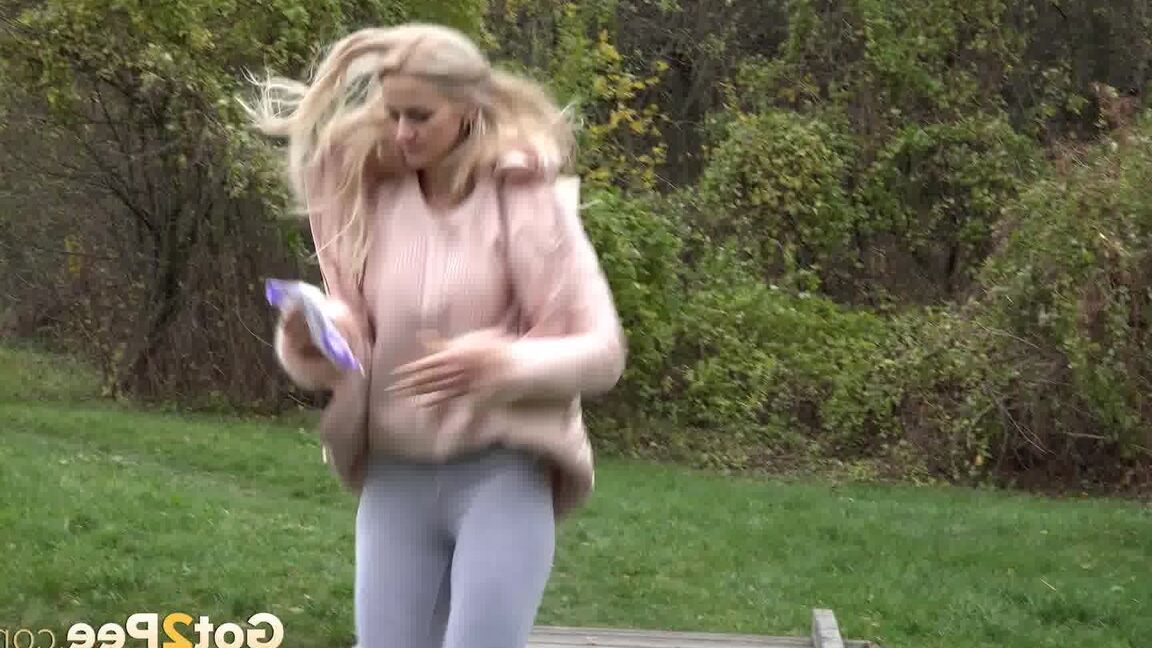 15P Blonde Katy Sky shows her bald beaver while squatting outside for a pee