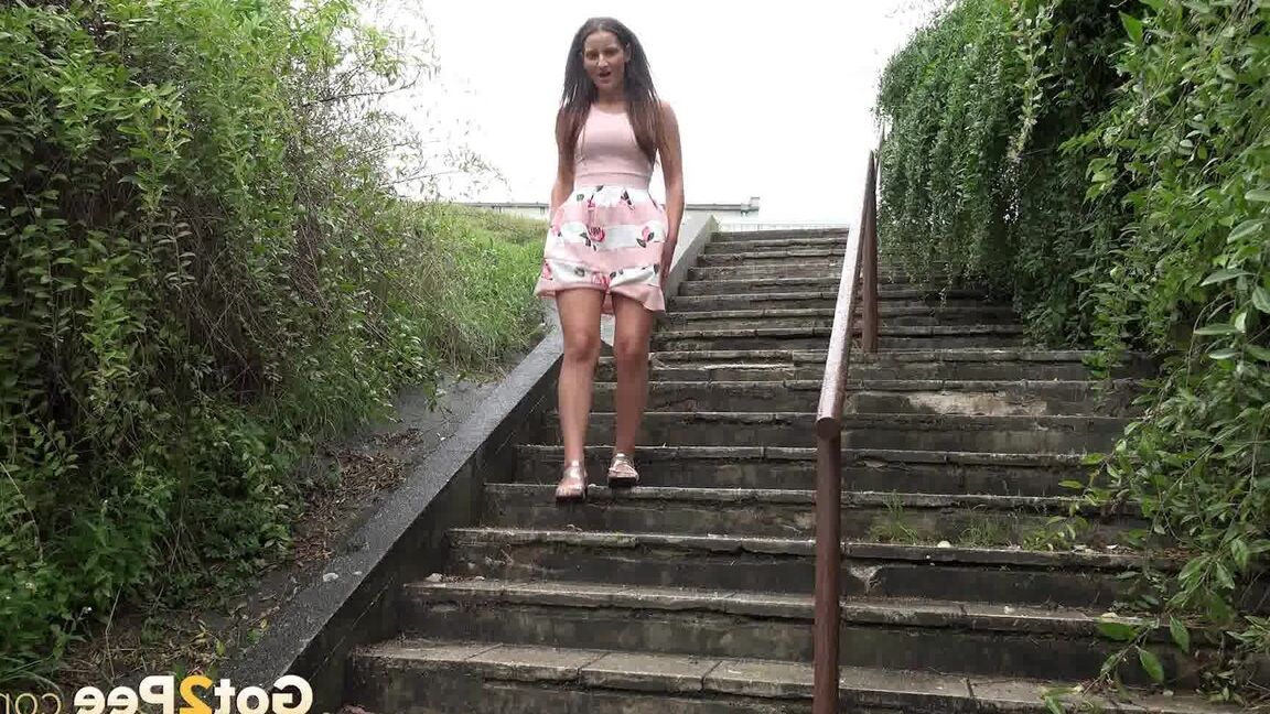 15P Caucasian teen Nicolette Noir pees while descending a flight of public stairs