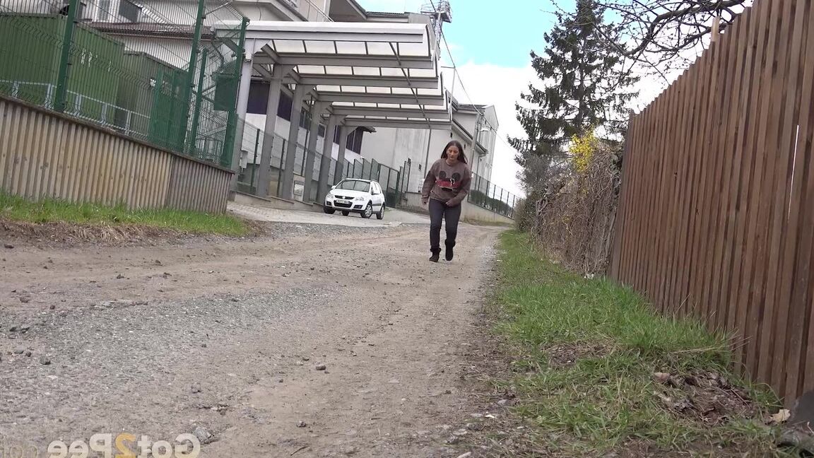 15P Caucasian teen Nicolette Noir pulls down her pants for a pee on a dirt pathway