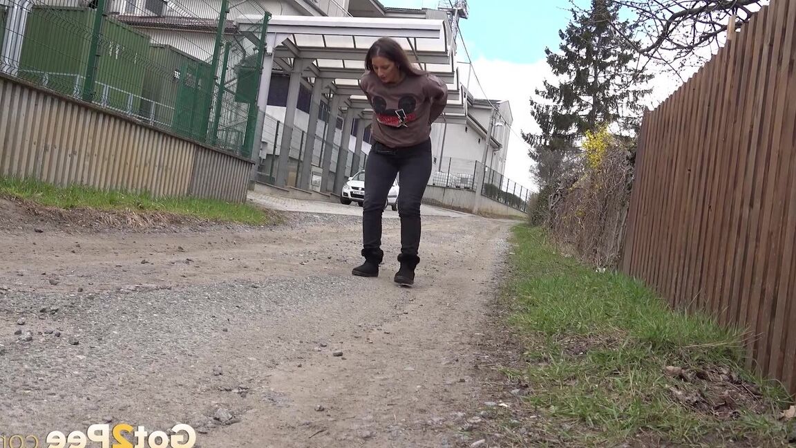15P Caucasian teen Nicolette Noir pulls down her pants for a pee on a dirt pathway
