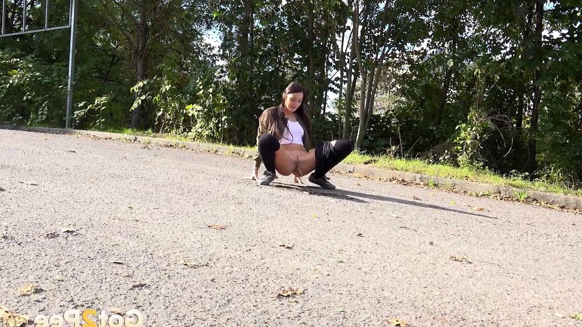 15P White girl Katy Rose takes a piss on a road while wearing hooker socks