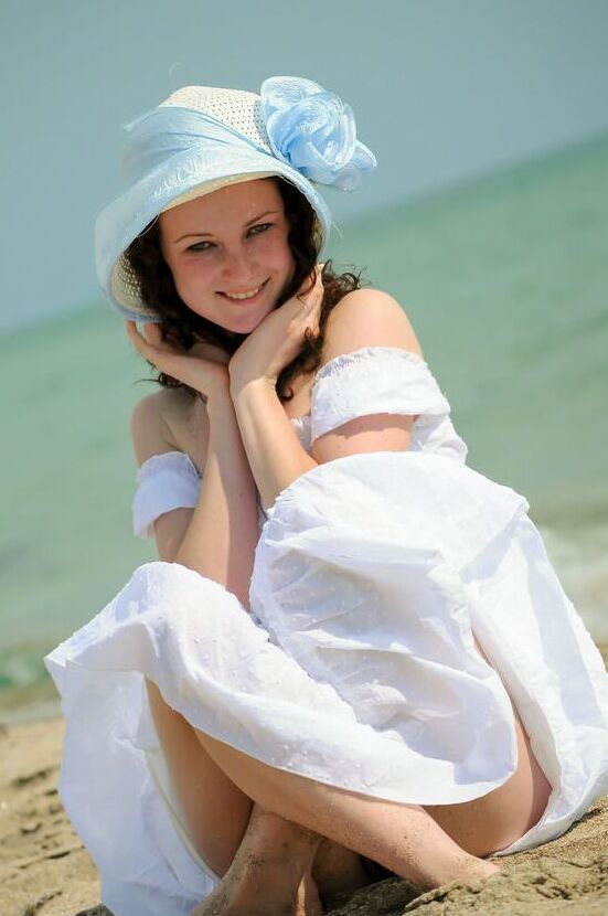 16P Charming 18-year-old Christina F gets completely naked on a sandy beach