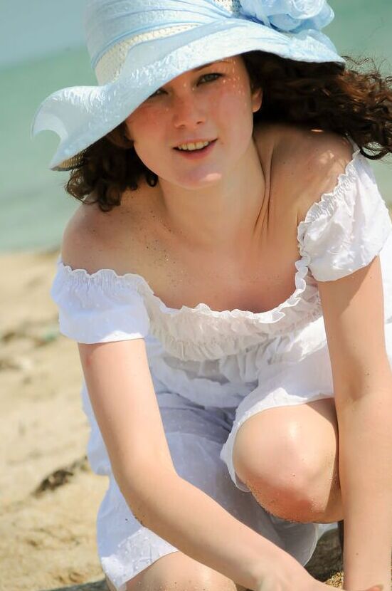 16P Charming 18-year-old Christina F gets completely naked on a sandy beach