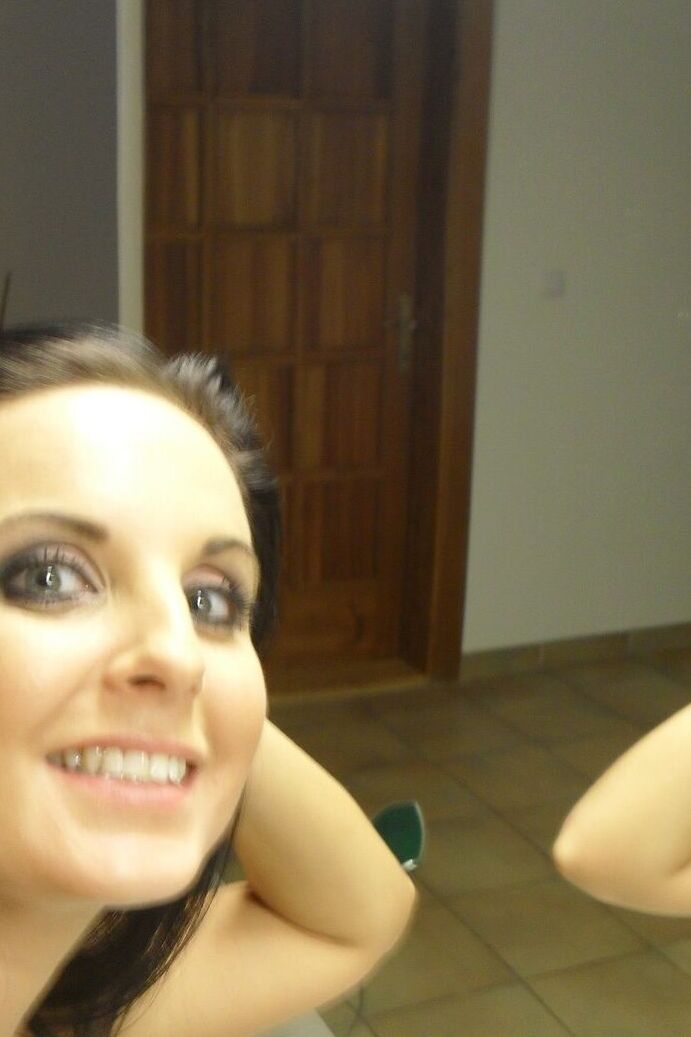 21P Sweet black haired babe Tara Tattoo strips and poses in front of a mirror